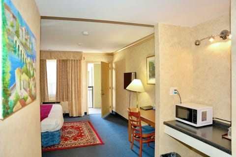 Standard Room, 1 King Bed, Non Smoking, Balcony | Desk, laptop workspace, blackout drapes, iron/ironing board