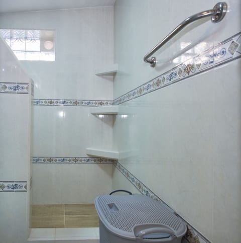 Comfort Room | Bathroom | Rainfall showerhead, towels, soap, toilet paper