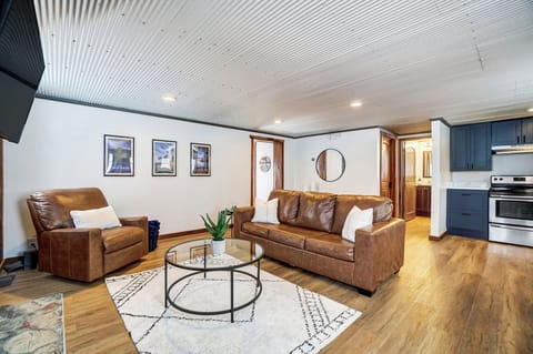 The living room provides ample seating, an electric fireplace and TV with Roku.