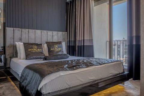 Deluxe Suite | Premium bedding, minibar, desk, laptop workspace