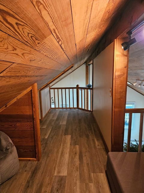 Kids' 3rd floor loft with low/slanted ceilings. Small room back left.