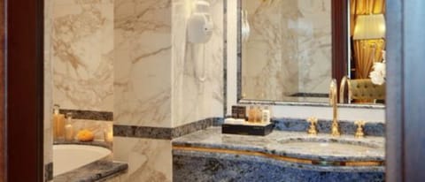 Suite, Lake View | Bathroom | Combined shower/tub, free toiletries, hair dryer, bidet