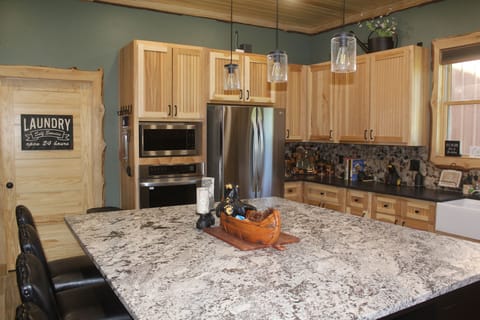 This kitchen has 2 ovens & a microwave oven

