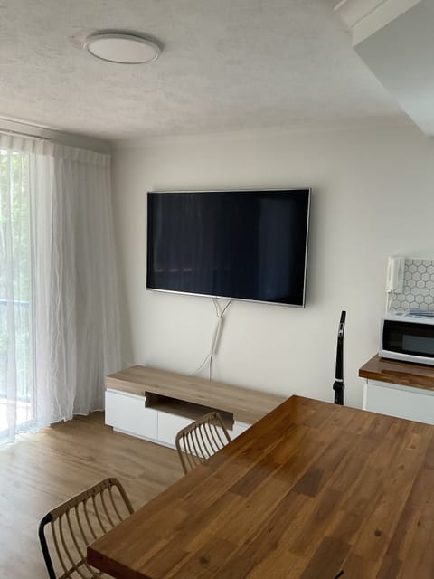 1 Bedroom Refurbished Air Conditioned Apartment | Living area | 50-inch flat-screen TV with cable channels, TV, DVD player