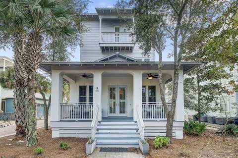 Front Porch of Surf on Turf in the Seacrest Beach Community on 30A! Relax and unwind on our front porch, a cozy haven nestled beneath the lush canopy of trees. This serene setting offers a tranquil retreat, inviting you to relax and connect with nature!