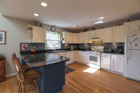 Experience luxury in the spacious kitchen with granite countertops.