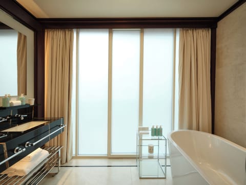 Premier Studio | Bathroom | Rainfall showerhead, designer toiletries, hair dryer, bathrobes