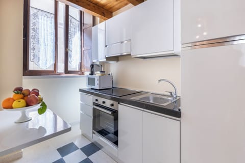 Luxury Apartment (Eolo) | Private kitchen | Full-size fridge, microwave, stovetop, espresso maker