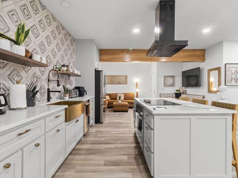 Main floor; Kitchen area - smartly organized with dedicated zones for cooking, prepping, and cleaning, ensuring a clutter-free and functional culinary workspace.