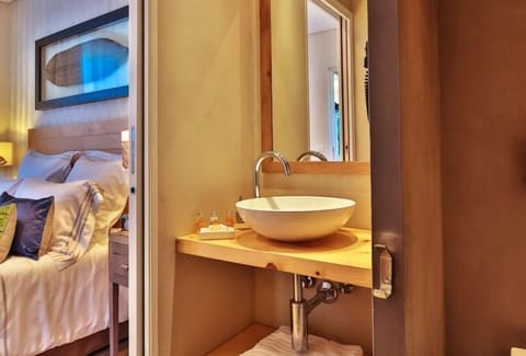 Deluxe Room | Bathroom | Designer toiletries, hair dryer, bathrobes, slippers