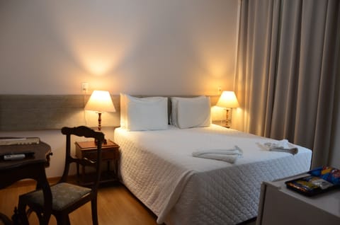 Standard Double Room | Minibar, desk, laptop workspace, blackout drapes