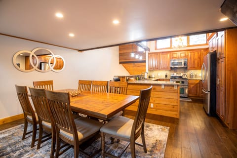 A view of the dining table and kitchen!