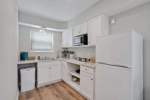 Family Apartment | Private kitchen | Mini-fridge, microwave, coffee/tea maker, freezer