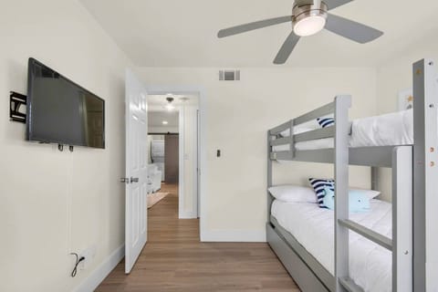 Experience a peaceful and relaxing sleep in this spacious bedroom featuring bunk bed