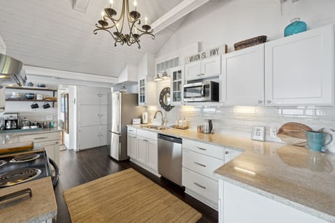 This pristine space is a minimalist's dream, with sleek lines and a bright, airy ambiance that creates an atmosphere of sophistication and functionality. 