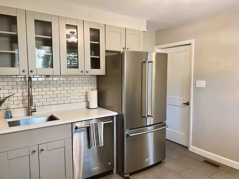 The kitchen has a full sized refrigerator and plenty of storage. Kitchen amenities are provided.