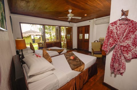 Junior Suite, Beachfront | Premium bedding, in-room safe, individually decorated