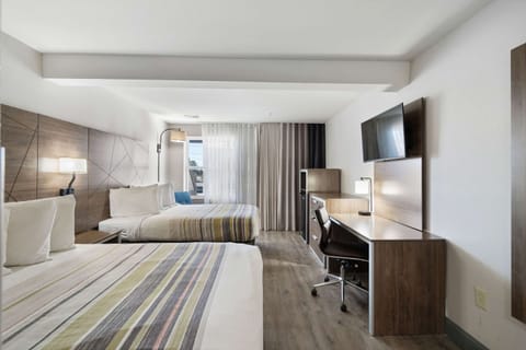 Suite, Multiple Beds, Non Smoking | Premium bedding, desk, laptop workspace, blackout drapes