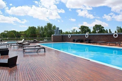 Seasonal outdoor pool, open 10:00 AM to 8:00 PM, free cabanas