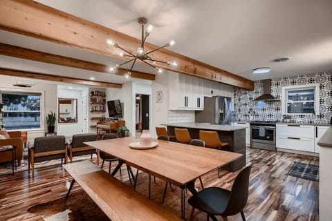 Stylish dining table with comfortable chairs, ideal for enjoying meals or playing board games