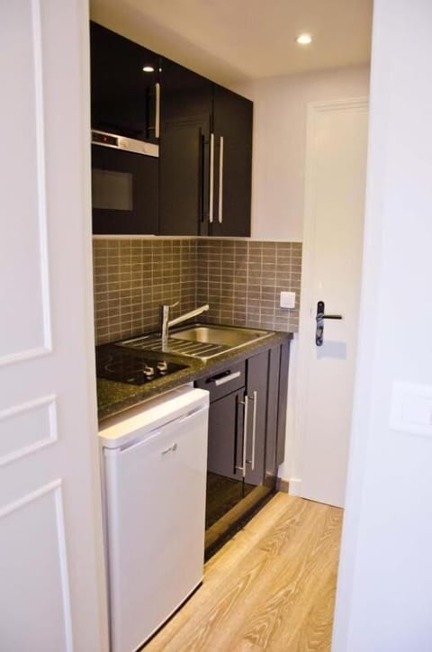 Apartment | Private kitchen | Fridge, microwave, stovetop, cookware/dishes/utensils