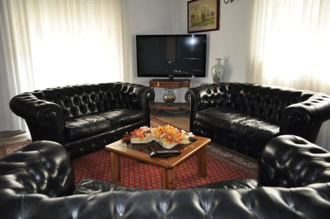 Standard Apartment, 1 Bedroom | Living area | Flat-screen TV