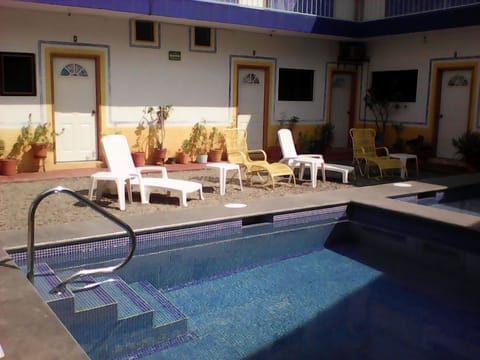 Outdoor pool, open 9:00 AM to 8:00 PM, pool umbrellas, sun loungers