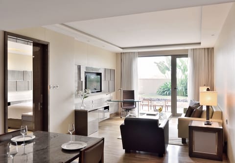 Deluxe Suite, 1 Bedroom | Living room | 32-inch LCD TV with cable channels, TV, iPod dock