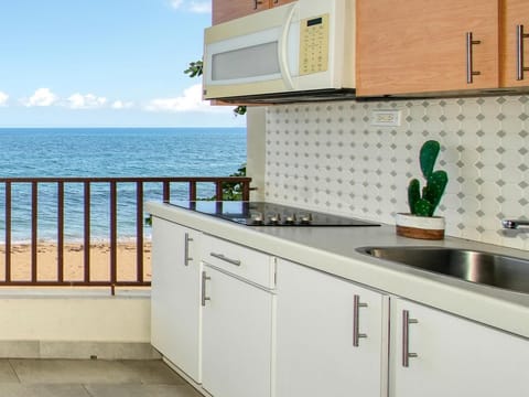 Apartment, Ocean View, Beachfront | Private kitchen | Fridge, coffee/tea maker