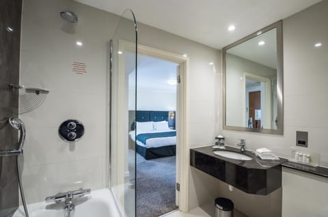Suite, 1 King Bed | Bathroom | Combined shower/tub, free toiletries, hair dryer, towels