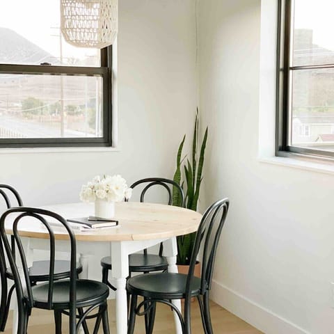 A dining nook that doubles as a home office during the day. That is if you can work without being too distracted by the views!