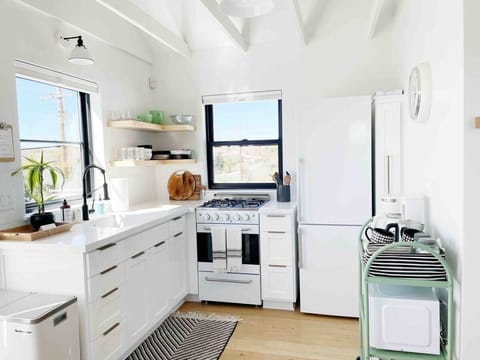 Save money by preparing your own meals in the kitchen! The market is just a mile away.