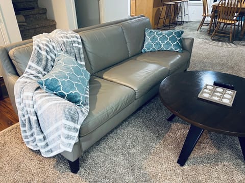 Relax on this genuine leather sofa while you watch some TV or chat by the fire!