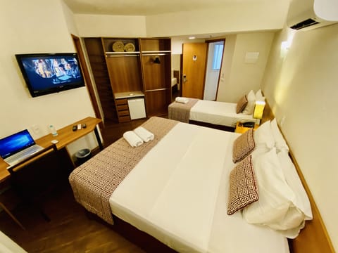 Triple Room (1 Double + 1 Single Bed ) | Minibar, in-room safe, desk, blackout drapes