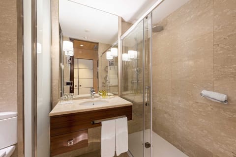 Triple Room, City View | Minibar, in-room safe, desk, laptop workspace