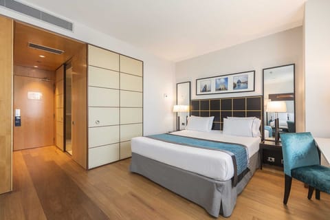 Triple Room, City View | Minibar, in-room safe, desk, laptop workspace