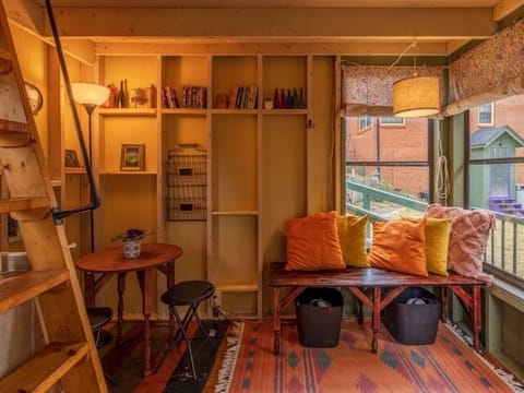 Cozy table for eating and window seat for relaxing and reading books.