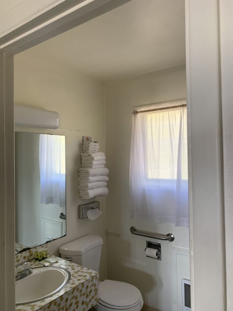 Standard Room, 2 Queen Beds | Bathroom | Combined shower/tub, free toiletries, hair dryer, towels