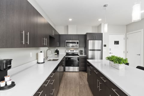 Design Apartment | Private kitchen | Full-size fridge, microwave, oven, stovetop