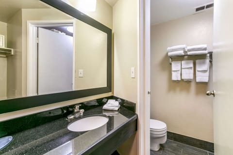 Standard Room, 2 Queen Beds, Non Smoking | Bathroom | Combined shower/tub, hair dryer, towels