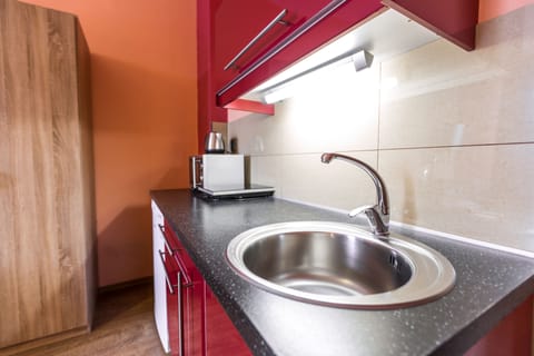 Standard Studio, Balcony | Private kitchenette | Stovetop, toaster, cleaning supplies