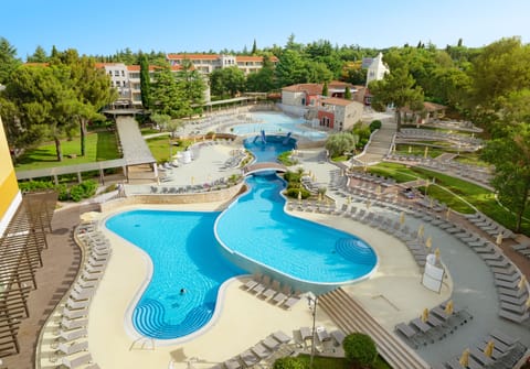 Indoor pool, seasonal outdoor pool, pool umbrellas, sun loungers