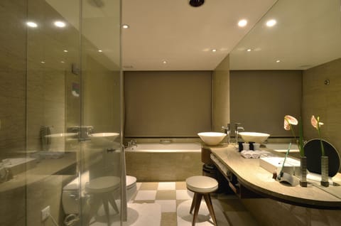 Suite, 1 King Bed, Non Smoking | Bathroom | Separate tub and shower, rainfall showerhead, designer toiletries