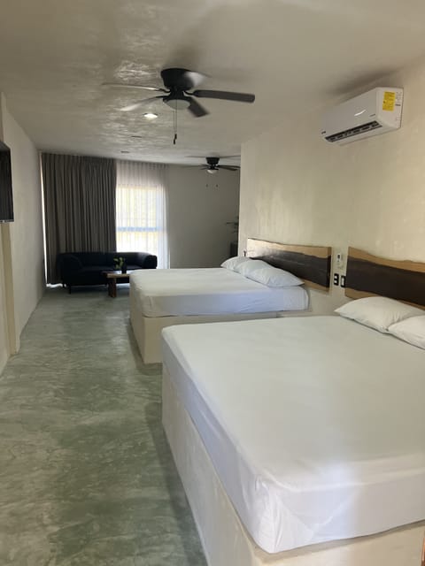 Room with Two King Beds with Street View and Private Bathroom | Minibar, in-room safe, free WiFi, bed sheets