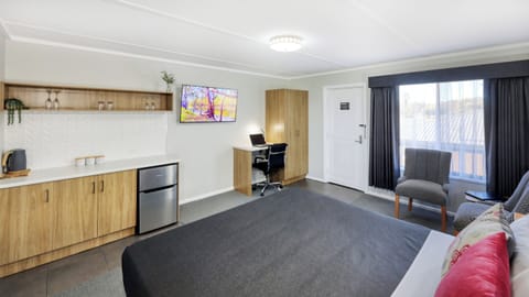 Superior Room | Desk, laptop workspace, blackout drapes, iron/ironing board