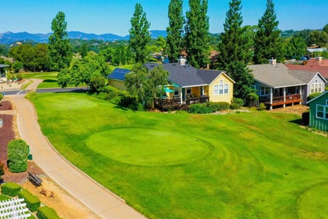 Aerial view of home along 8th fairway.