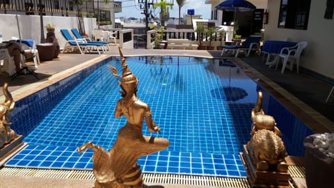 Outdoor pool, open 8:00 AM to 8:00 PM, sun loungers