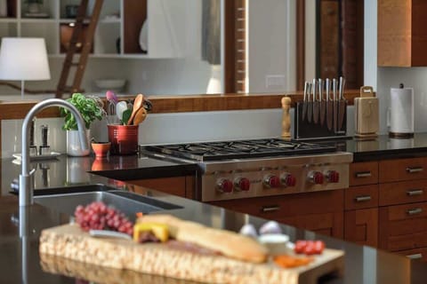 Use the custom kitchen to enjoy culinary delights.