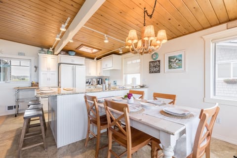 Seamless kitchen and dining, where culinary creations meet family gatherings.