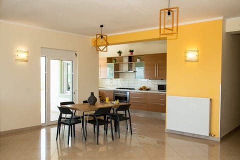 Create lasting memories in our kitchen with the large dining table, perfect for savoring delightful moments of relaxation.